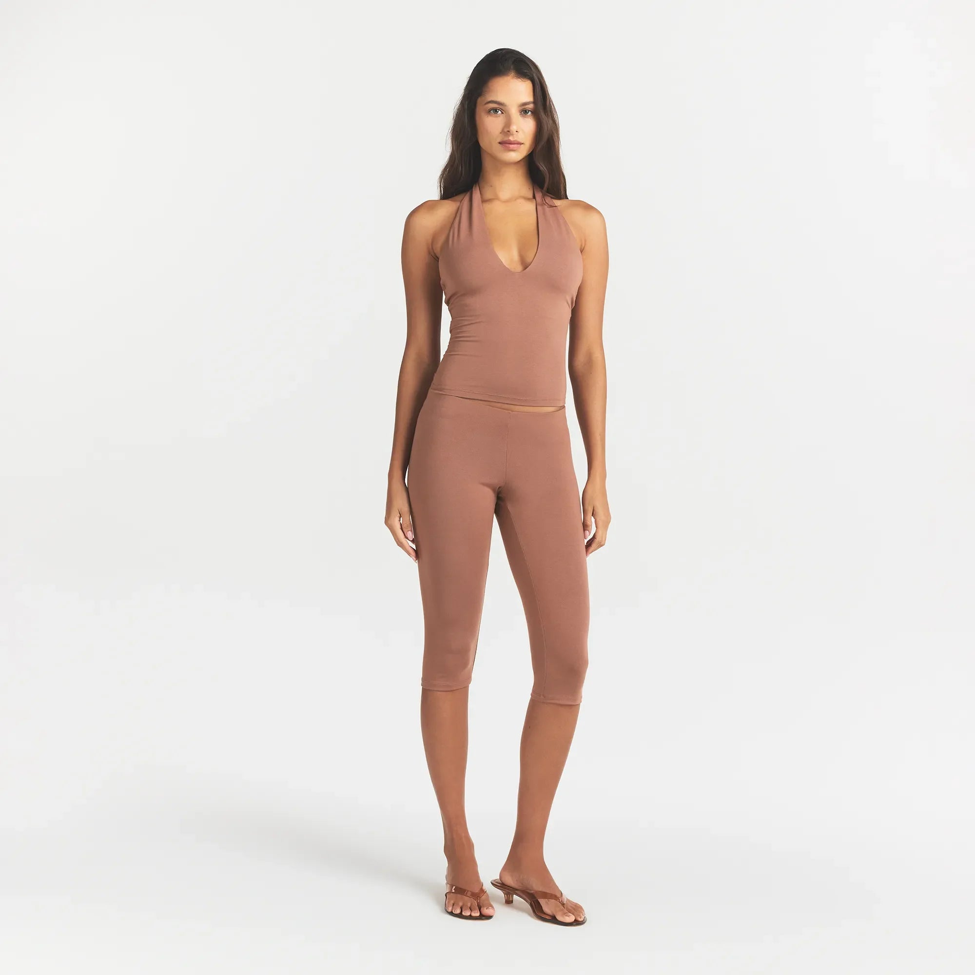 SMOOTH LAYERS HIGH-WAISTED CAPRI | NUTMEG ON A MODEL FRONT VIEW @ | FOCUS: 0.0, 1.0, 0.9