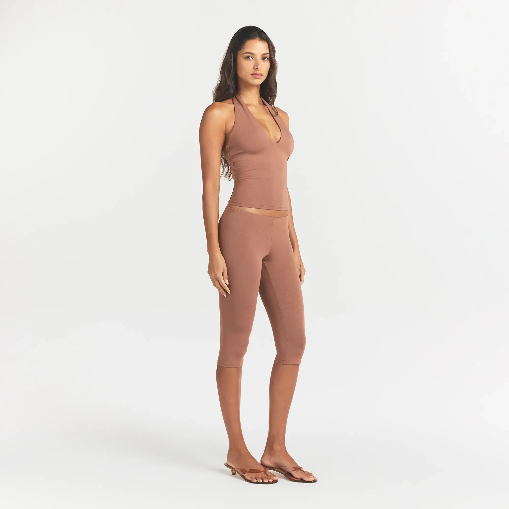 SMOOTH LAYERS HIGH-WAISTED CAPRI | NUTMEG ON A MODEL SIDE VIEW @ | FOCUS: 0.0, 1.0, 0.9