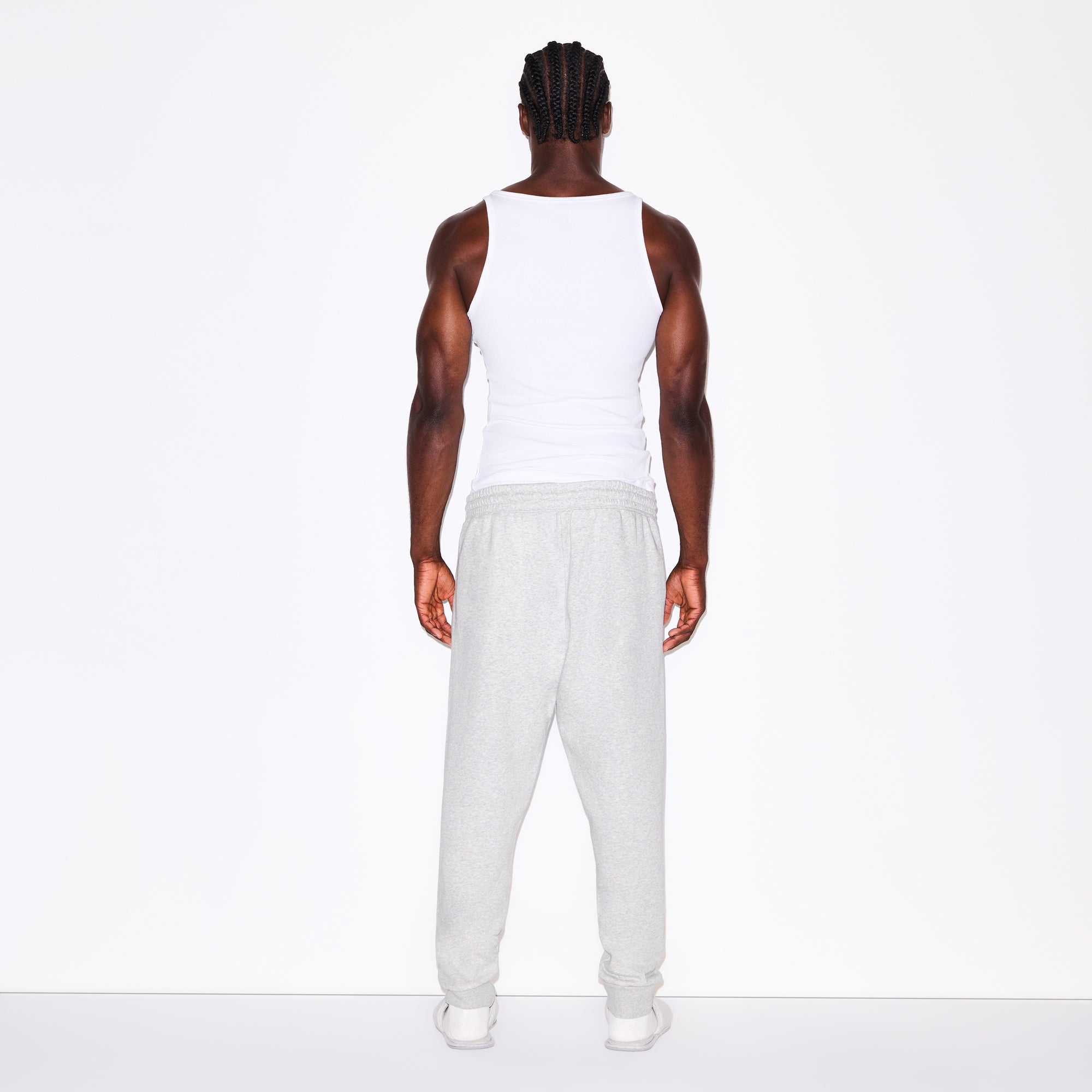FLEECE LOUNGE MENS TAPERED JOGGER | LIGHT HEATHER GREY ON A MODEL FRONT VIEW @ | FOCUS: 0.0, 1.0, 0.9