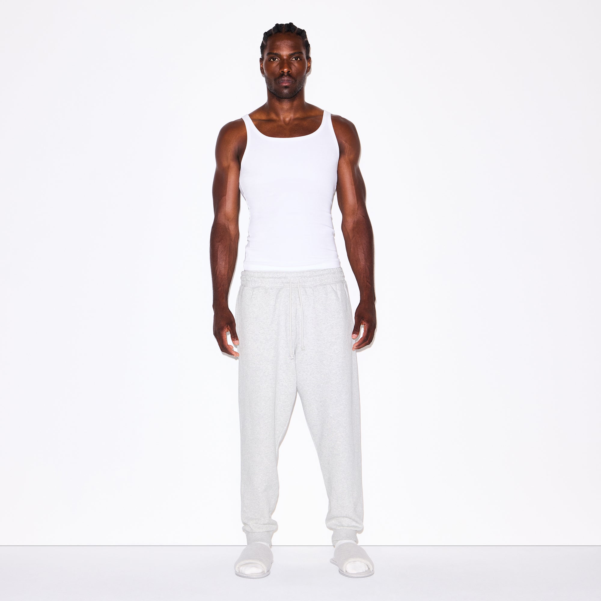 FLEECE LOUNGE MENS TAPERED JOGGER | LIGHT HEATHER GREY ON A MODEL FRONT VIEW @ | FOCUS: 0.0, 1.0, 0.9