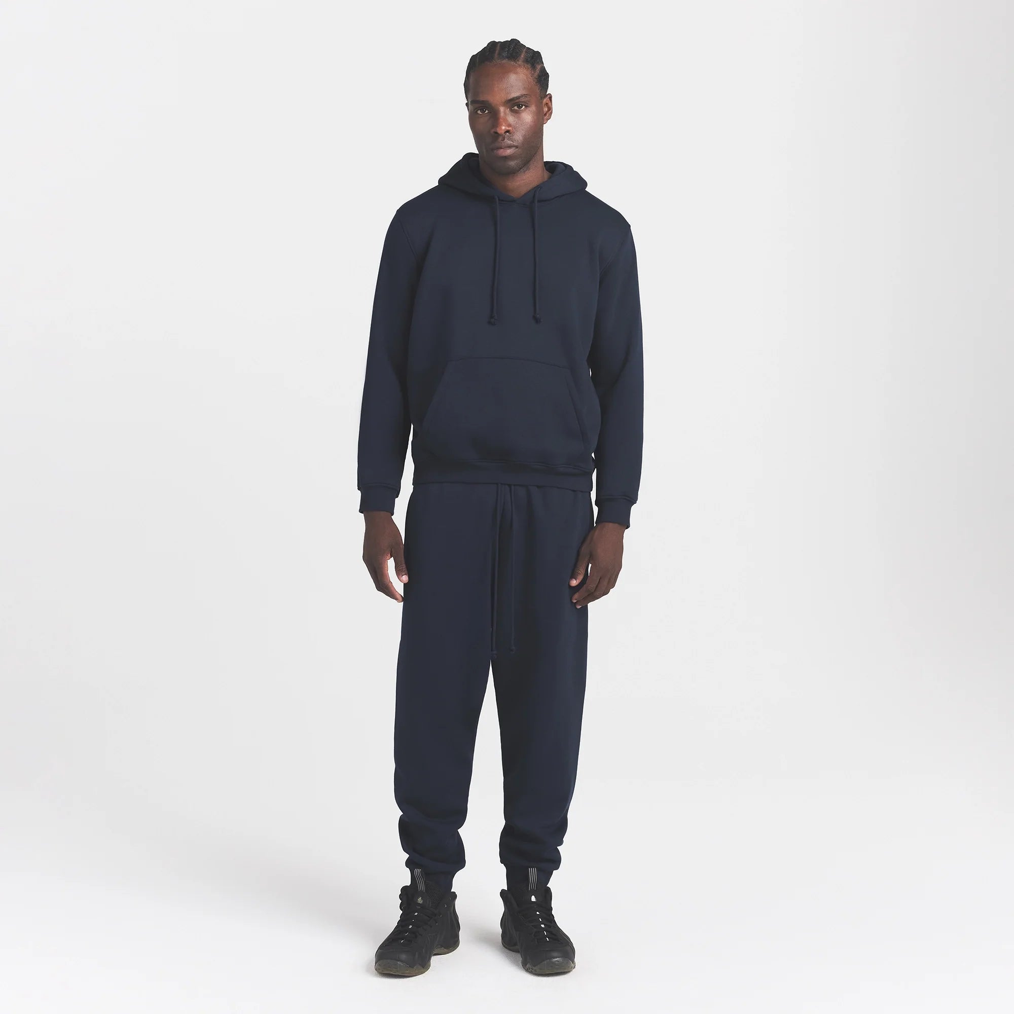 FLEECE LOUNGE MENS TAPERED JOGGER | NAVY ON A MODEL FRONT VIEW @ | FOCUS: 0.0, 1.0, 0.9