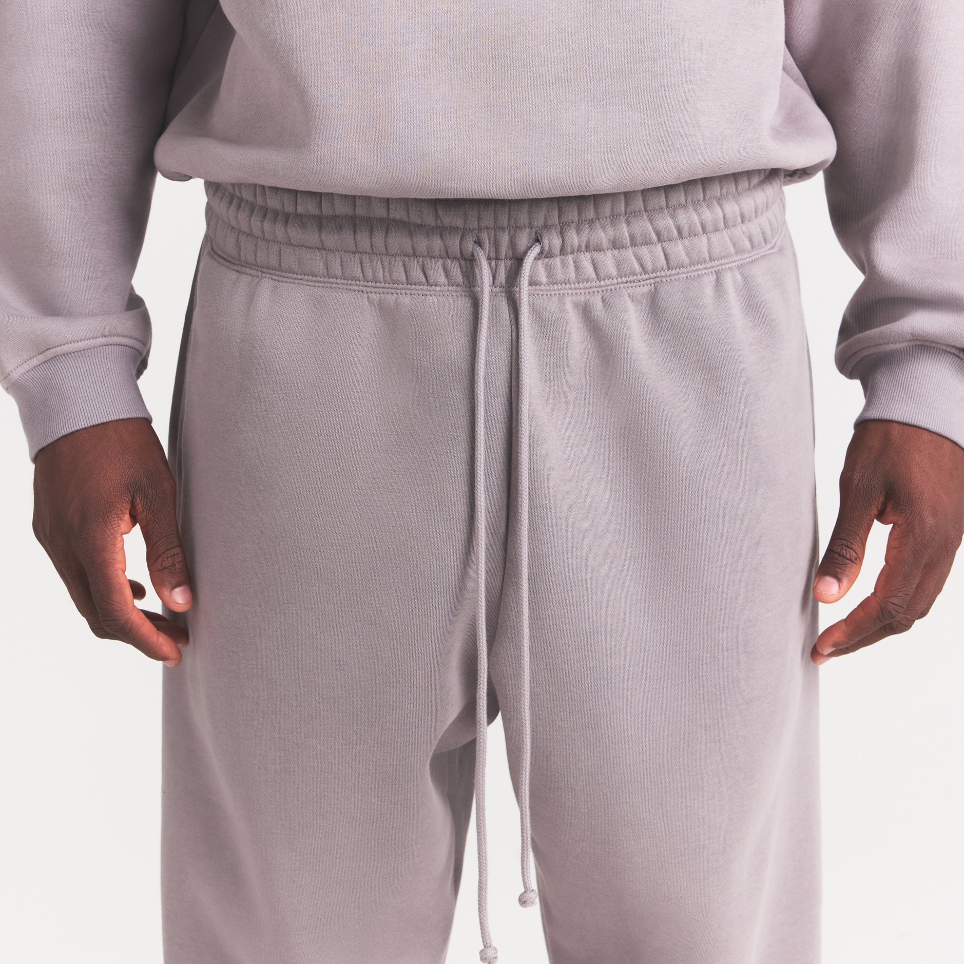 FLEECE LOUNGE MENS TAPERED JOGGER | SHADOW ON A MODEL SIDE VIEW @ | FOCUS: 0.0, 1.0, 0.9