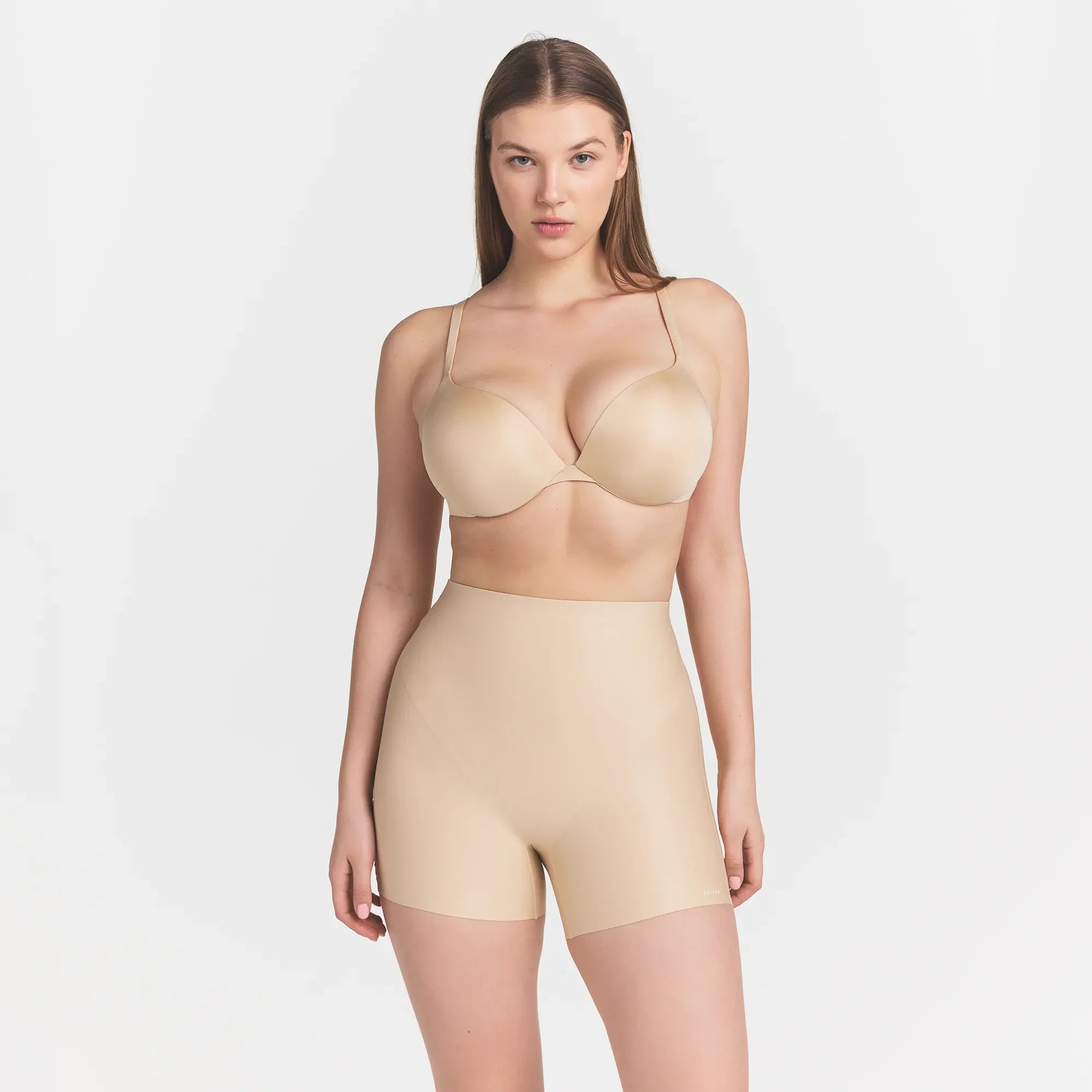 SKIMS BODY CORE SCULPT SHORTIE | SAND ON A MODEL FRONT VIEW @