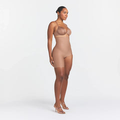 SKIMS BODY LEFT LEG SOLUTION SHORT | SIENNA ON A MODEL SIDE VIEW @