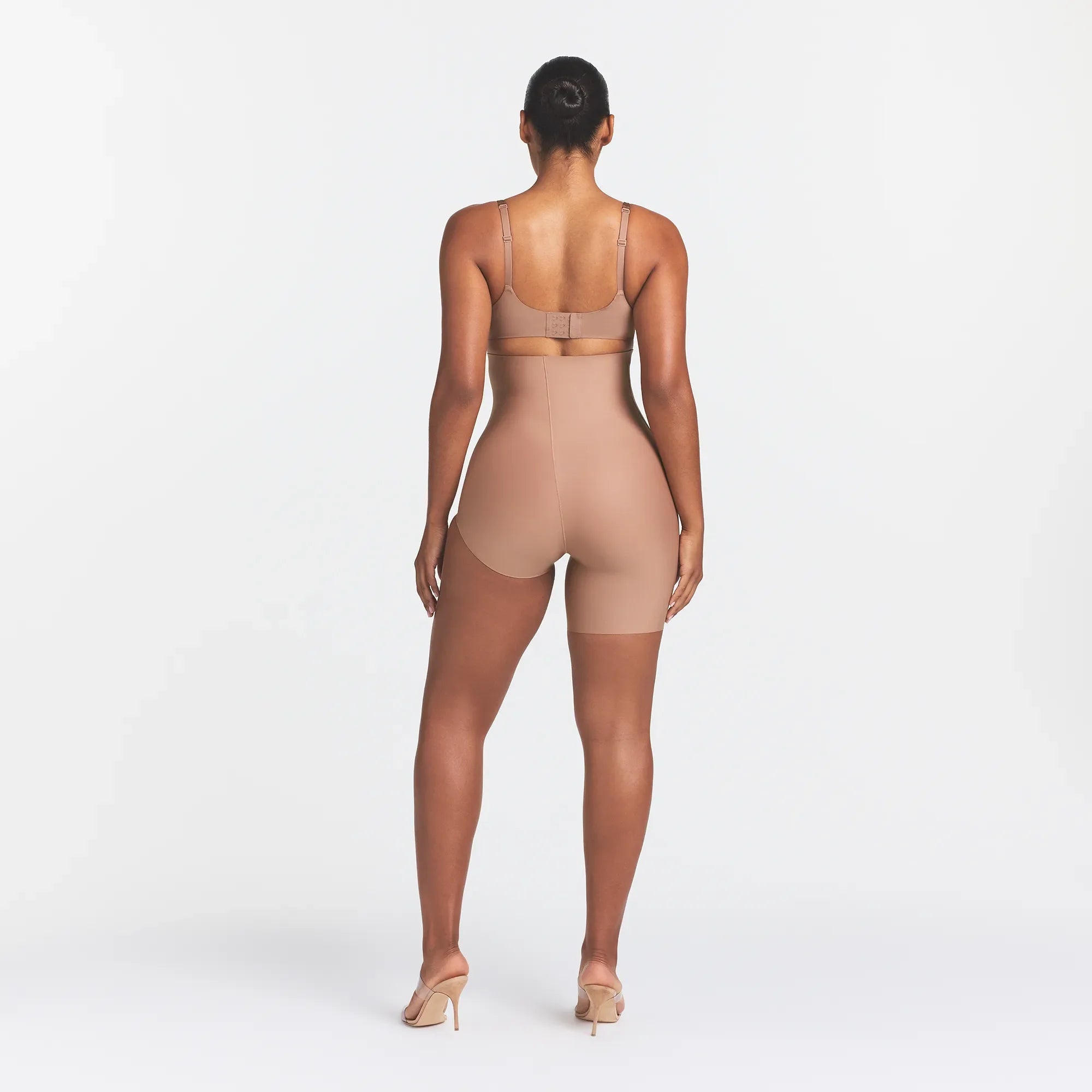 SKIMS BODY LEFT LEG SOLUTION SHORT | SIENNA ON A MODEL BACK VIEW @