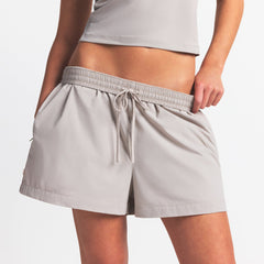 NikeSKIMS WOVEN NYLON 5" TRACK SHORT | STONE ON A MODEL FRONT VIEW @ | FOCUS: 0.0, 1.0, 0.9