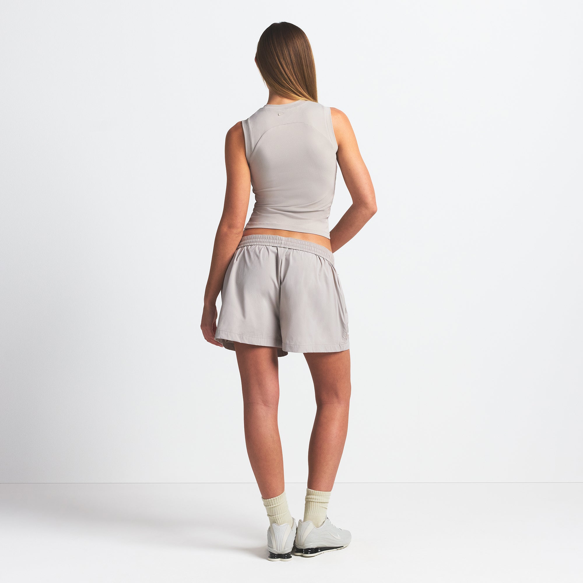 NikeSKIMS WOVEN NYLON 5" TRACK SHORT | STONE ON A MODEL BACK VIEW @ | FOCUS: 0.0, 1.0, 0.9
