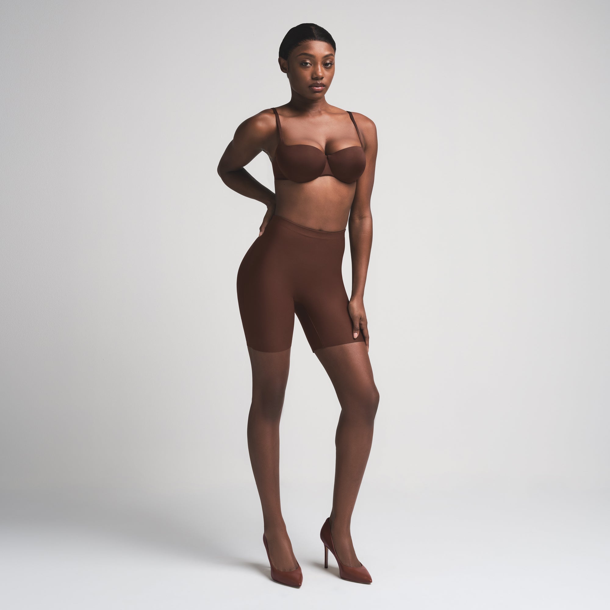 SKIMS BODY BUTT ENHANCING PADDED SHORT | COCOA ON A MODEL FRONT VIEW