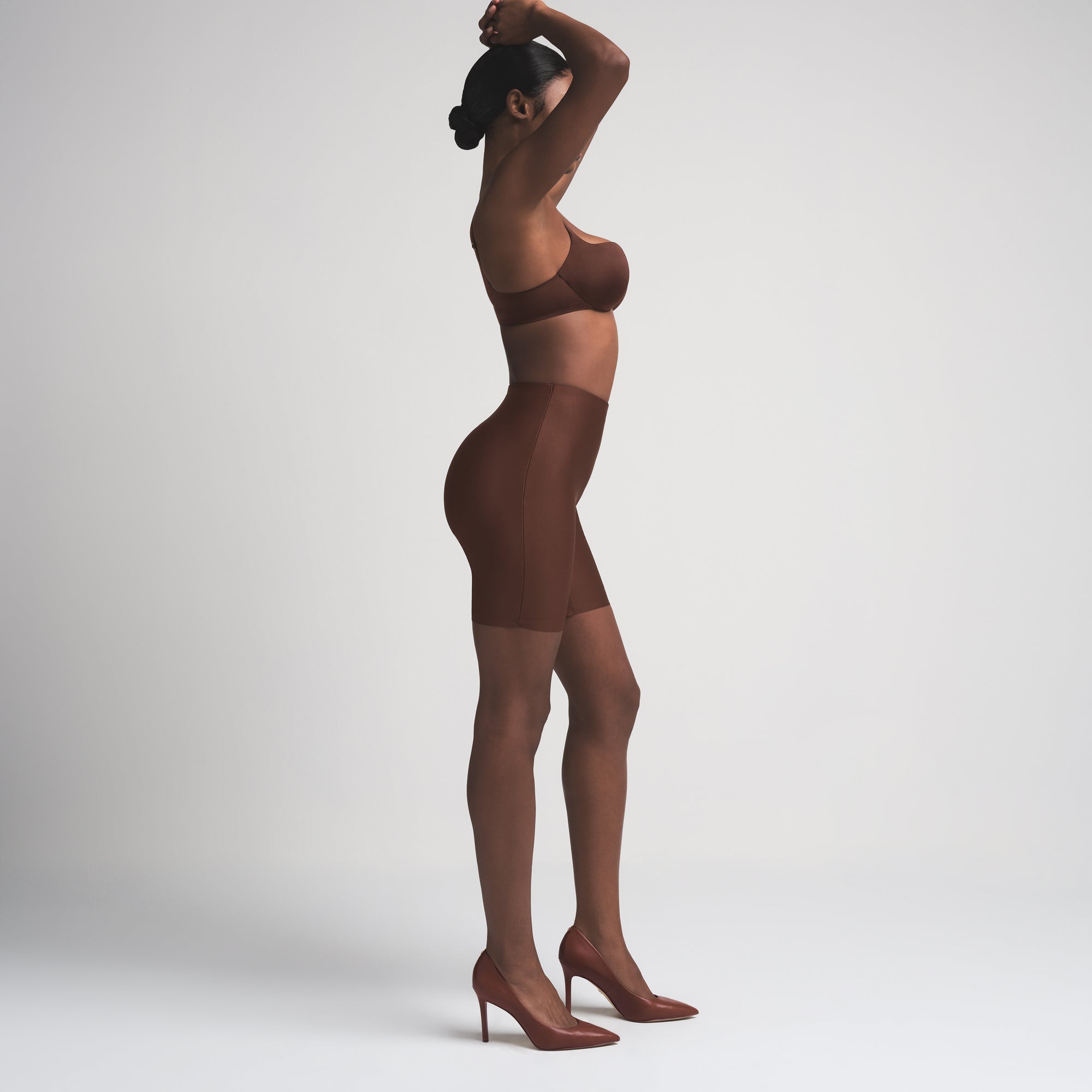 SKIMS BODY BUTT ENHANCING PADDED SHORT | COCOA ON A MODEL FRONT VIEW