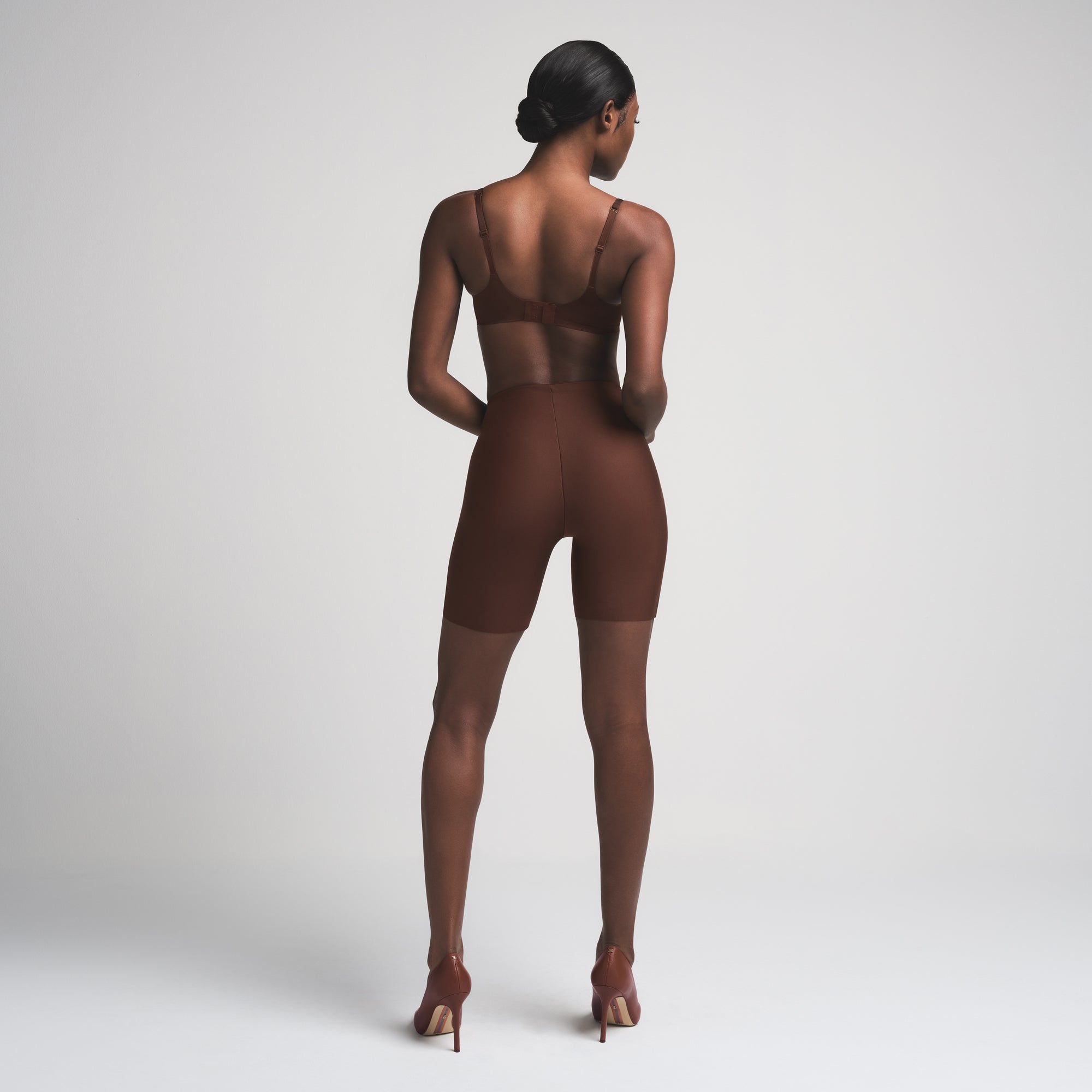 SKIMS BODY BUTT ENHANCING PADDED SHORT | COCOA ON A MODEL FRONT VIEW