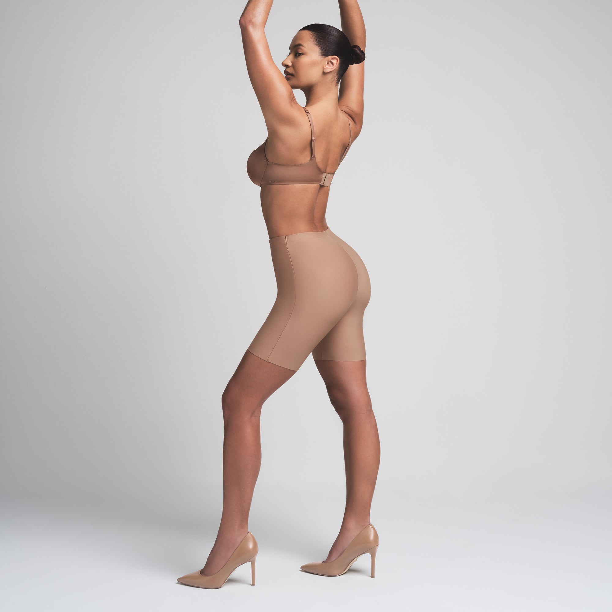 SKIMS BODY BUTT ENHANCING PADDED SHORT | SIENNA ON A MODEL FRONT VIEW