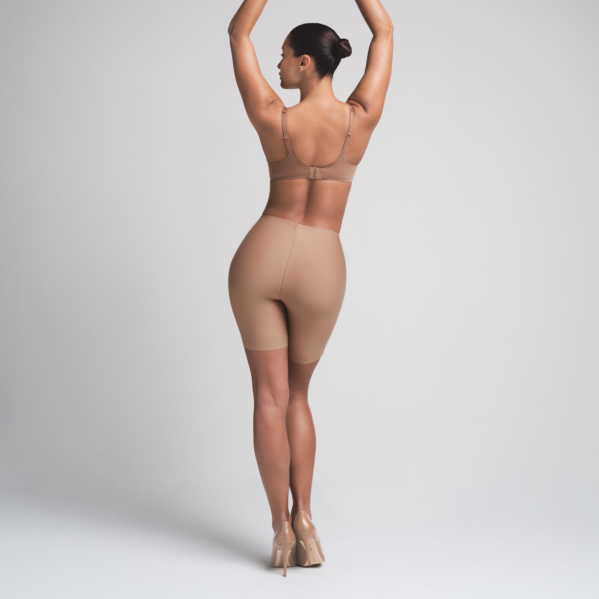 SKIMS BODY BUTT ENHANCING PADDED SHORT | SIENNA ON A MODEL FRONT VIEW