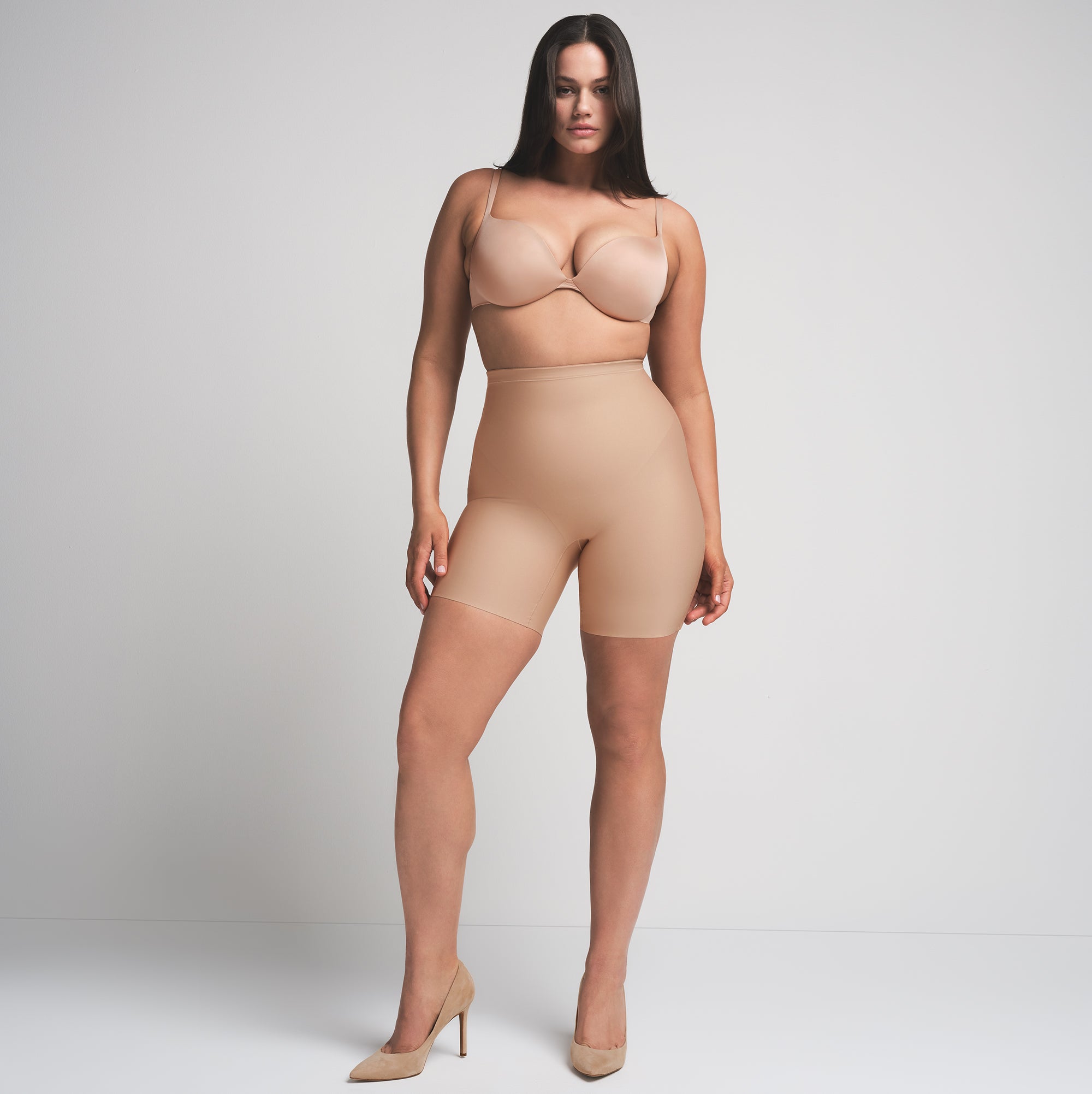 SKIMS BODY CORE SCULPT MID RISE SHORT | CLAY  ON A MODEL FRONT VIEW