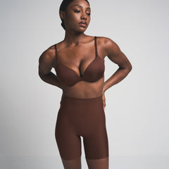 SKIMS BODY CORE SCULPT MID RISE SHORT | COCOA  ON A MODEL FRONT VIEW