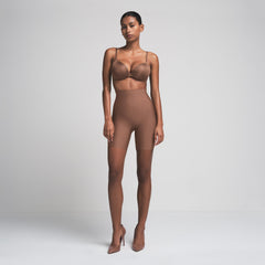 SKIMS BODY CORE SCULPT MID RISE SHORT | JASPER  ON A MODEL FRONT VIEW