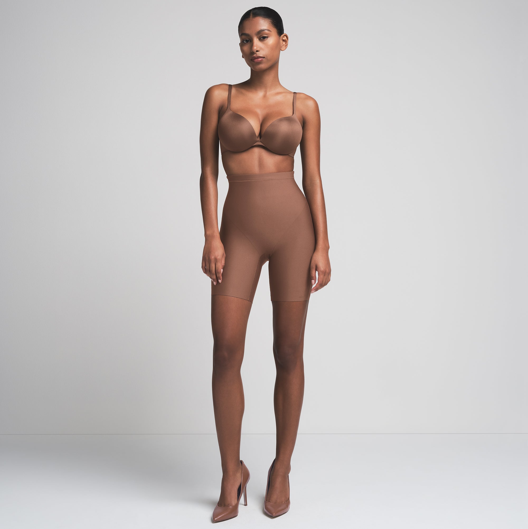 SKIMS BODY CORE SCULPT MID RISE SHORT | JASPER  ON A MODEL FRONT VIEW