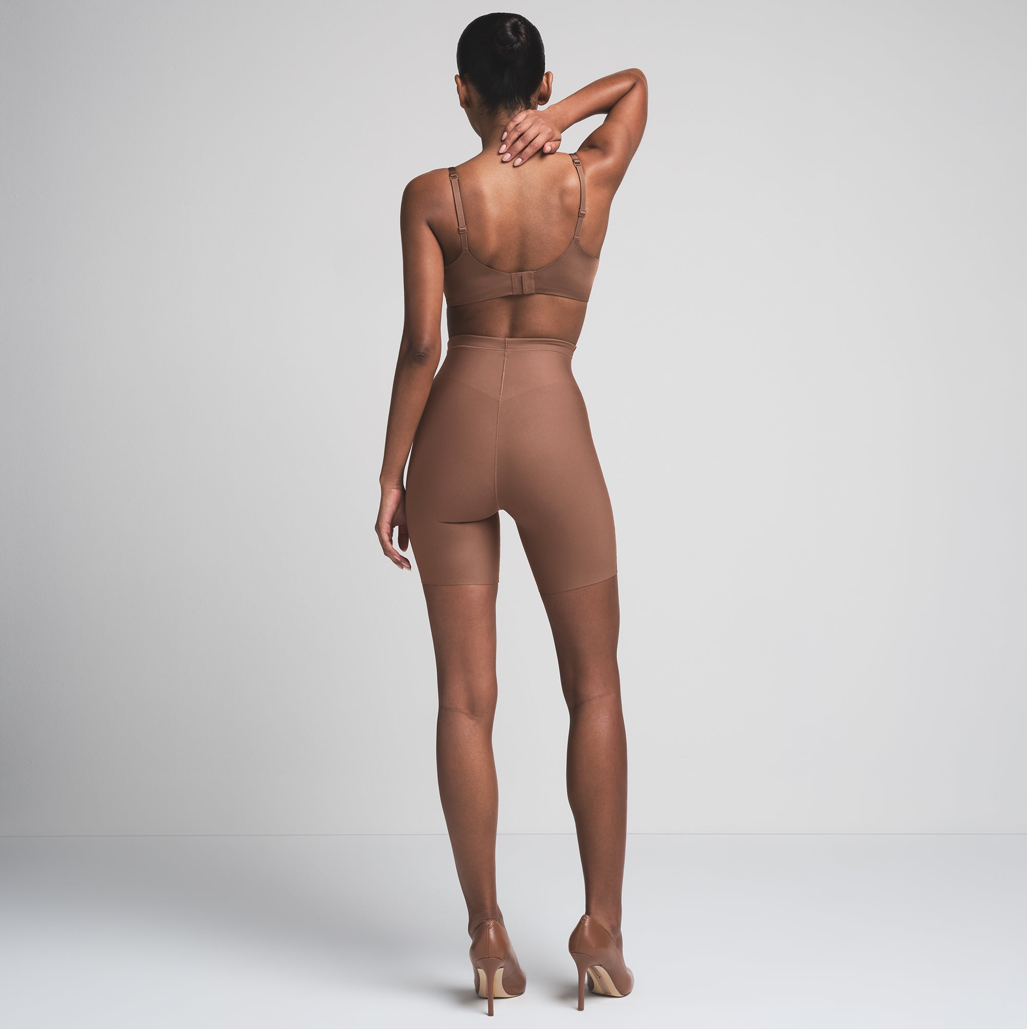 SKIMS BODY CORE SCULPT MID RISE SHORT | JASPER  ON A MODEL BACK VIEW