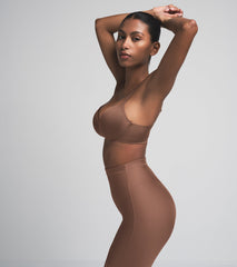 SKIMS BODY CORE SCULPT MID RISE SHORT | JASPER  ON A MODEL SIDE VIEW