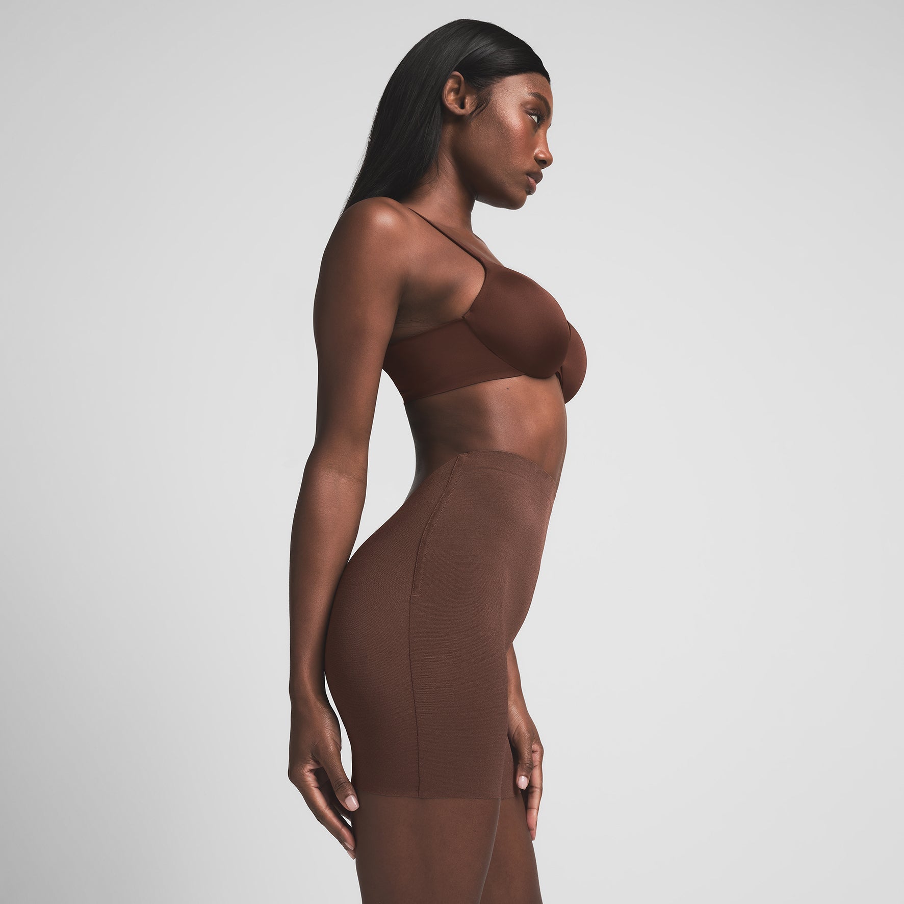 SHEER SCULPT LOW BACK SHORT | COCOA ON A MODEL SIDE VIEW