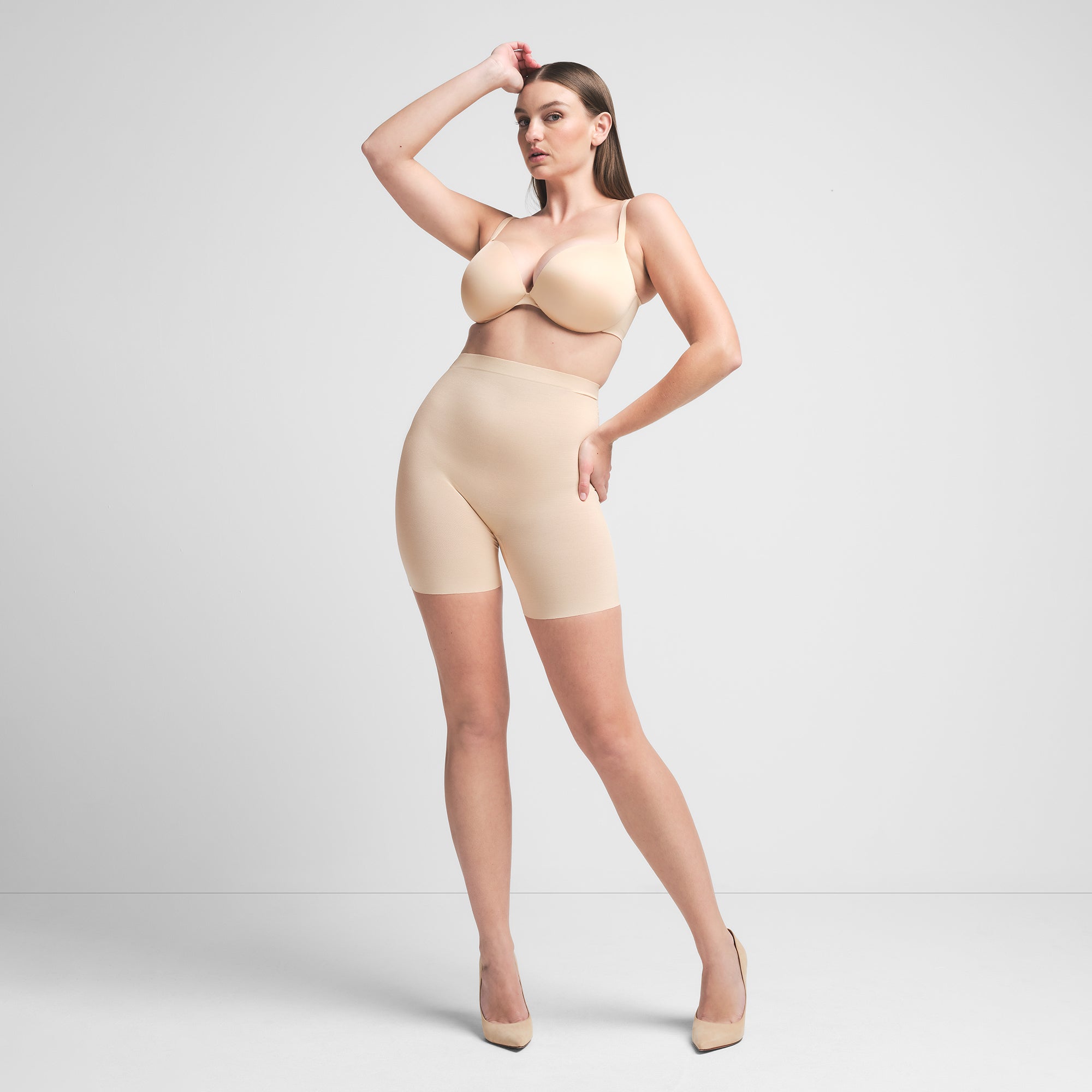 SHEER SCULPT LOW BACK SHORT | SAND ON A MODEL FRONT VIEW