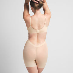 SHEER SCULPT LOW BACK SHORT | SAND ON A MODEL BACK VIEW