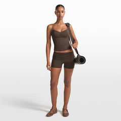 NikeSKIMS MATTE 3" FOLDOVER SHORT | DARK SEPIA ON A MODEL FRONT VIEW @ | FOCUS: 0.0, 1.0, 0.9