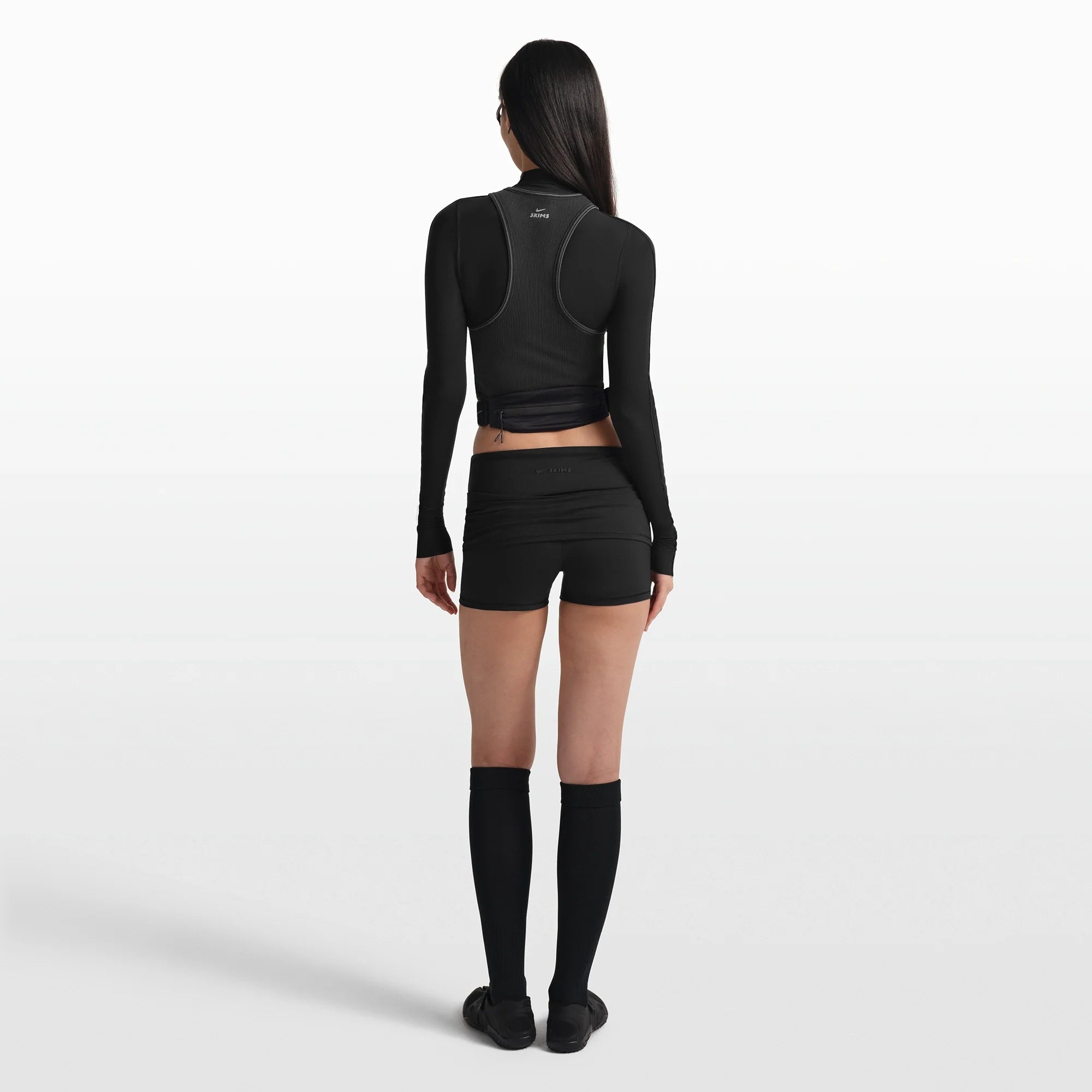 NikeSKIMS MATTE 3" FOLDOVER SHORT | OBSIDIAN ON A MODEL FRONT VIEW @ | FOCUS: 0.0, 1.0, 0.9