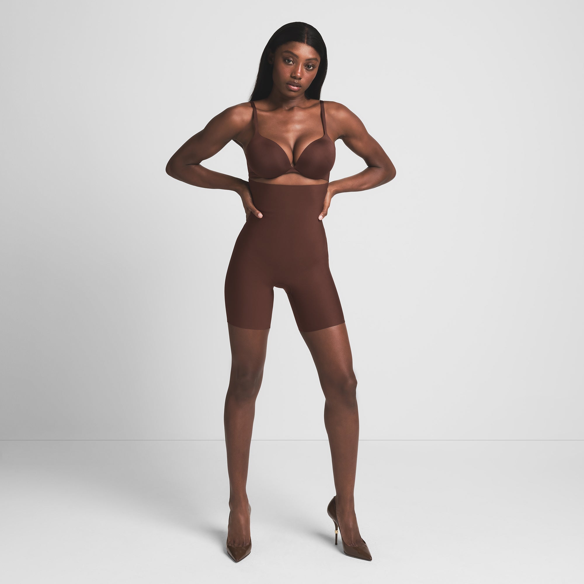 SKIMS BODY CORE SCULPT HIGH-WAISTED SHORT | COCOA ON A MODEL FRONT VIEW