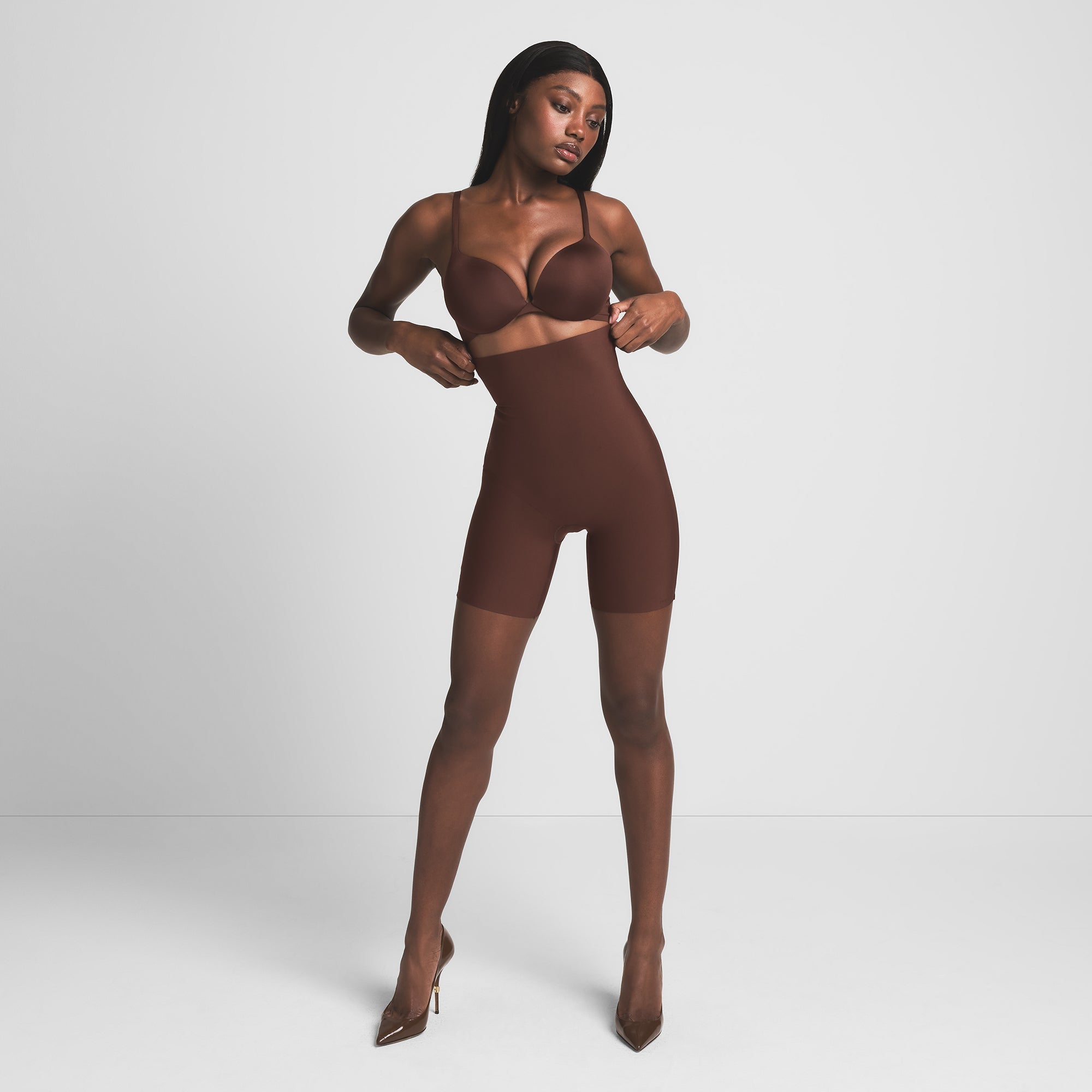SKIMS BODY CORE SCULPT HIGH-WAISTED SHORT | COCOA ON A MODEL FRONT VIEW