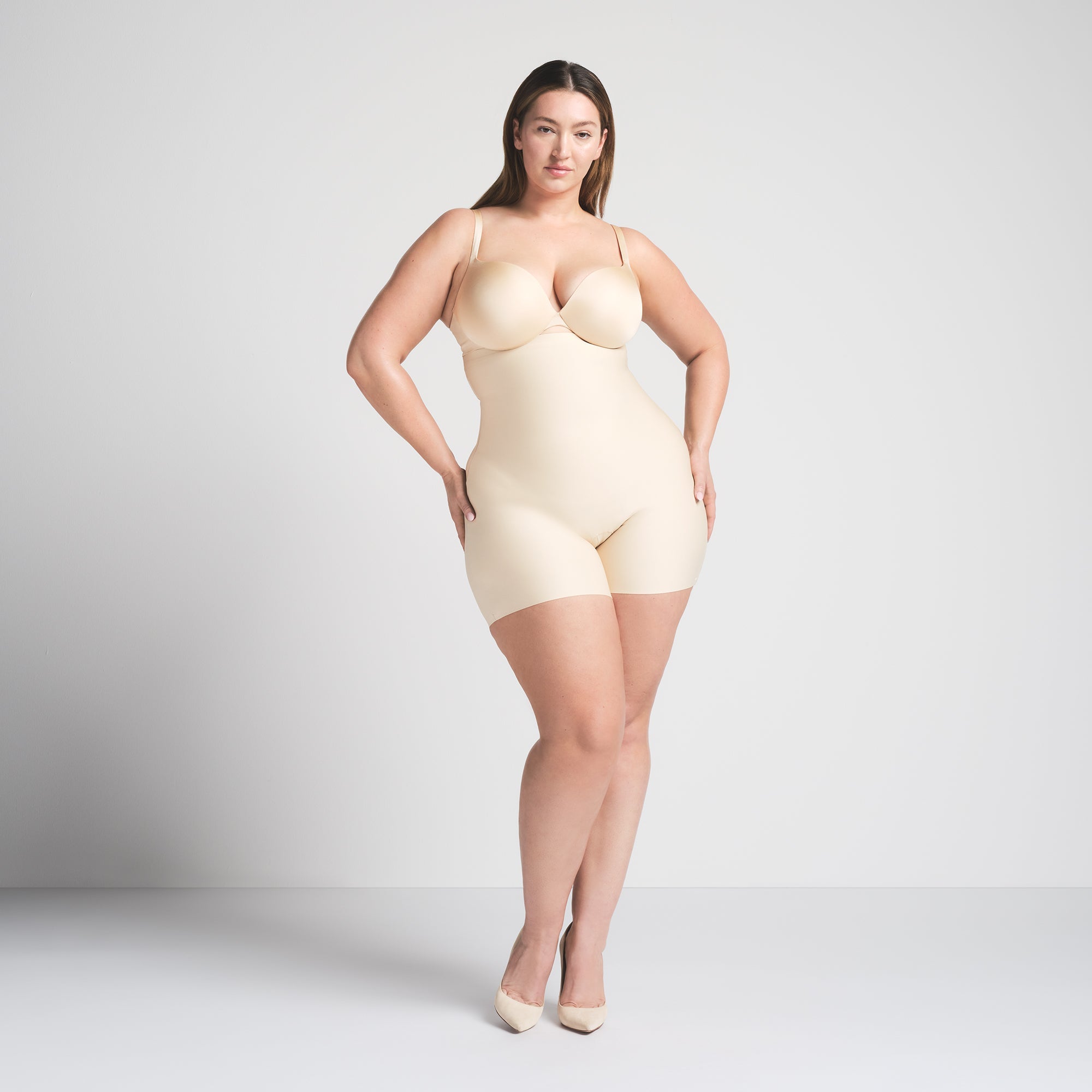 SKIMS BODY CORE SCULPT HIGH-WAISTED SHORT | SAND ON A MODEL FRONT VIEW @