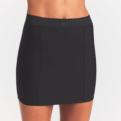 SKIMS BODY MINI GARTER SKIRT | ONYX ON A MODEL SIDE VIEW @