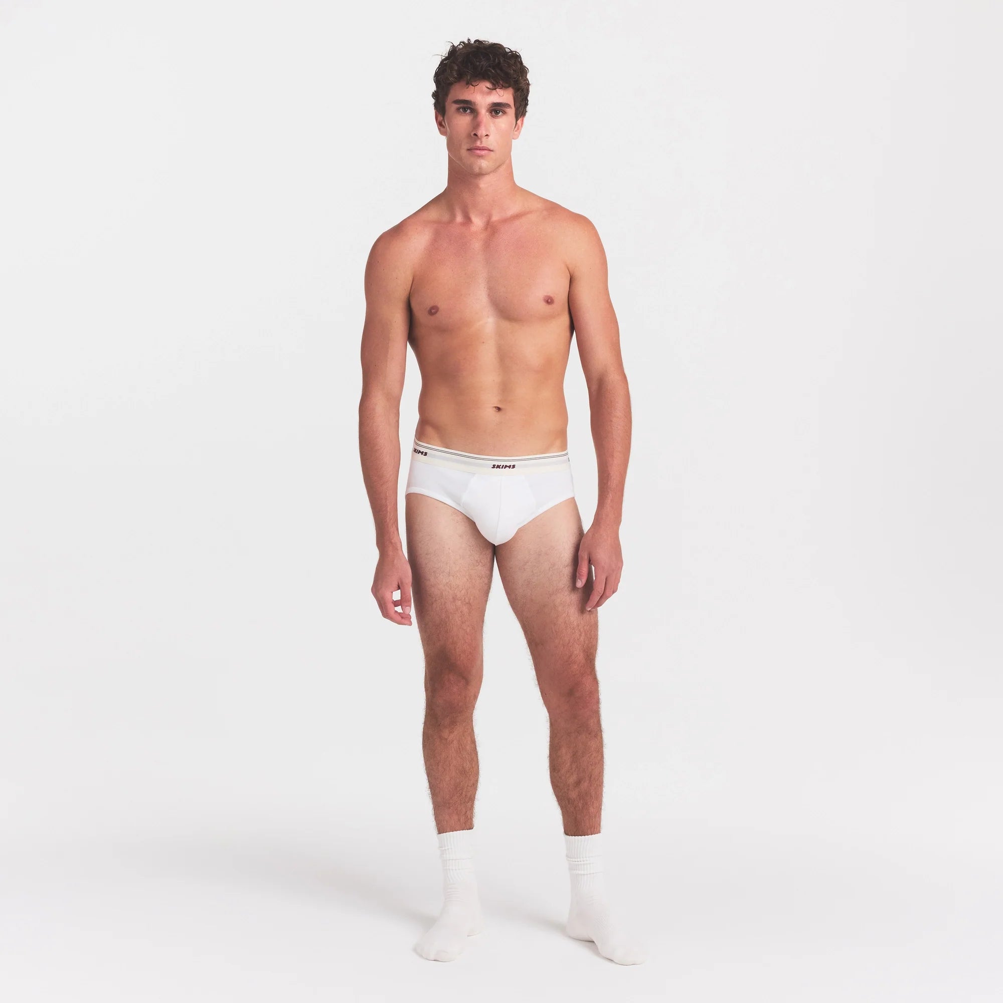 SKIMS COTTON RIB MENS BRIEF | CHALK ON A MODEL FRONT VIEW @ | FOCUS: 0.0, 1.0, 0.9