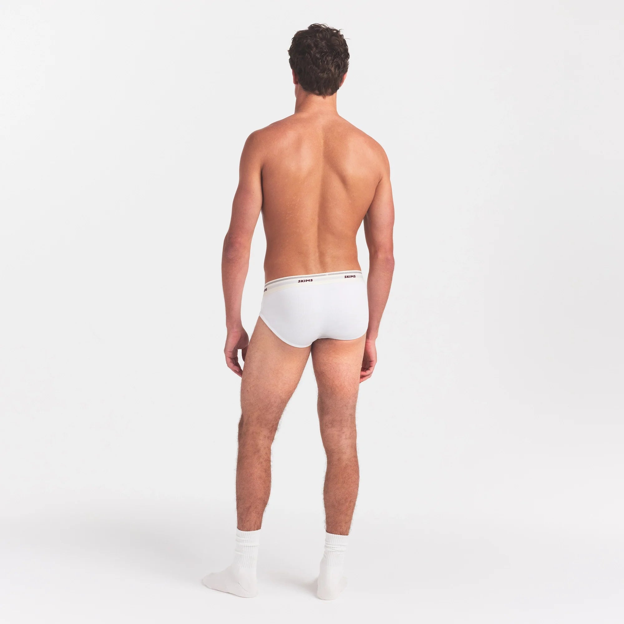 SKIMS COTTON RIB MENS BRIEF | CHALK ON A MODEL FRONT VIEW @ | FOCUS: 0.0, 1.0, 0.9