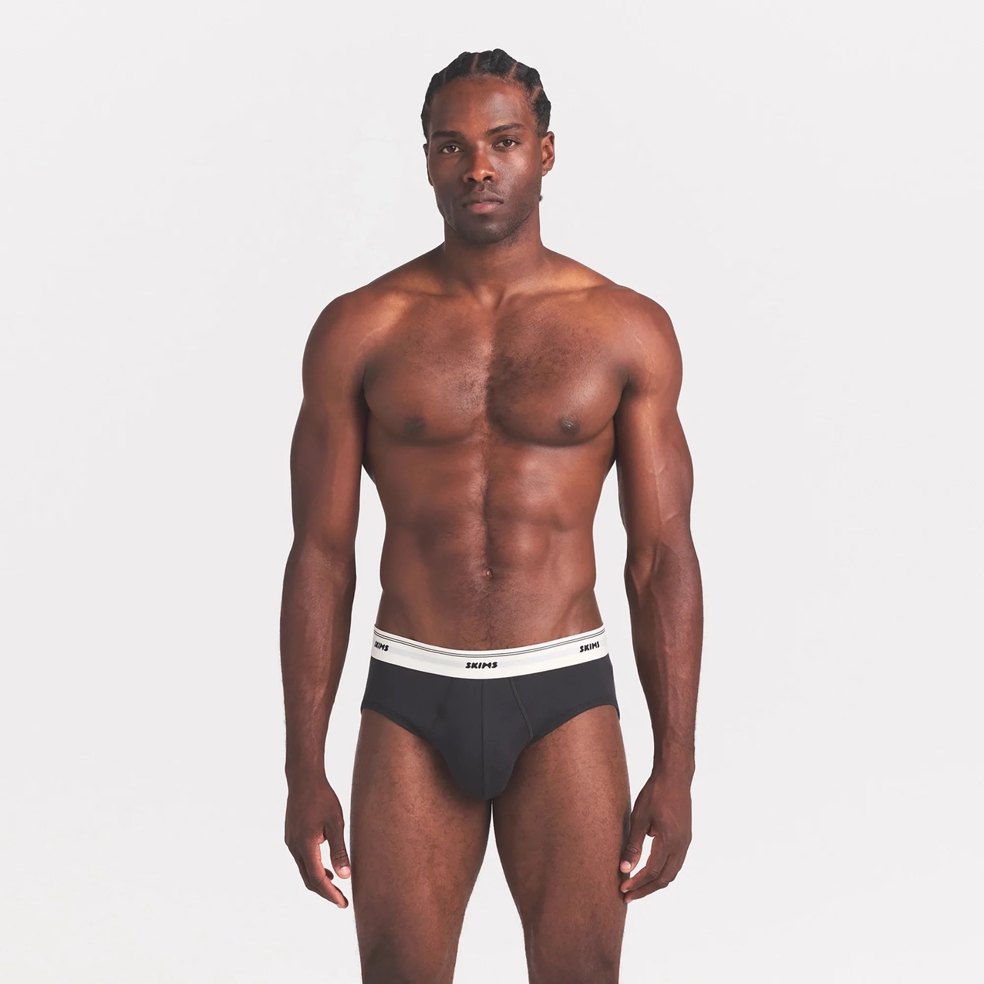 SKIMS COTTON RIB MENS BRIEF | ONYX ON A MODEL SIDE VIEW @ | FOCUS: 0.0, 1.0, 0.9