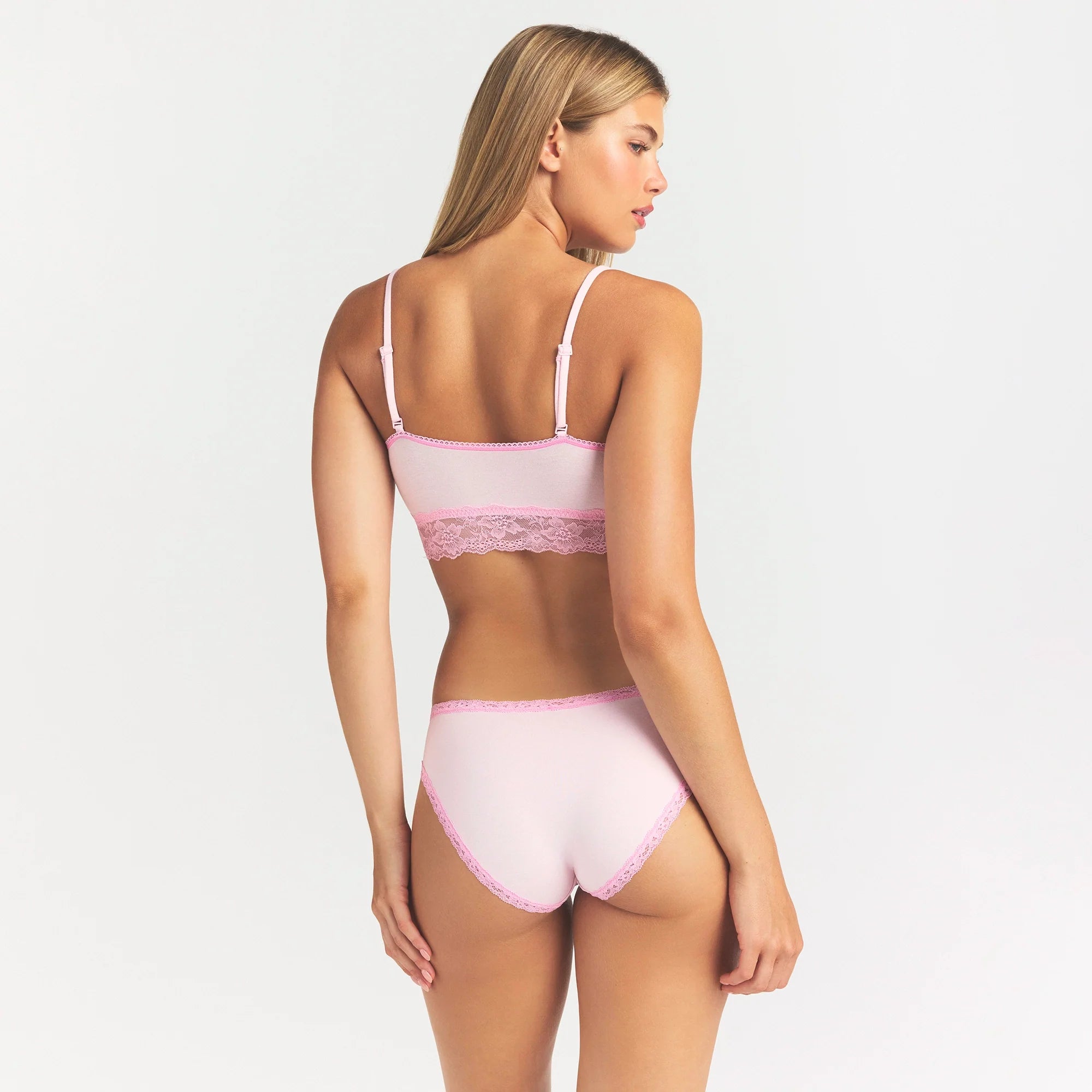 LIGHTWEIGHT COTTON LACE BRIEF | CHERRY BLOSSOM ON A MODEL SIDE VIEW @ | FOCUS: 0.0, 1.0, 0.9