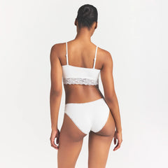 LIGHTWEIGHT COTTON LACE BRIEF | SNOW ON A MODEL SIDE VIEW @ | FOCUS: 0.0, 1.0, 0.9