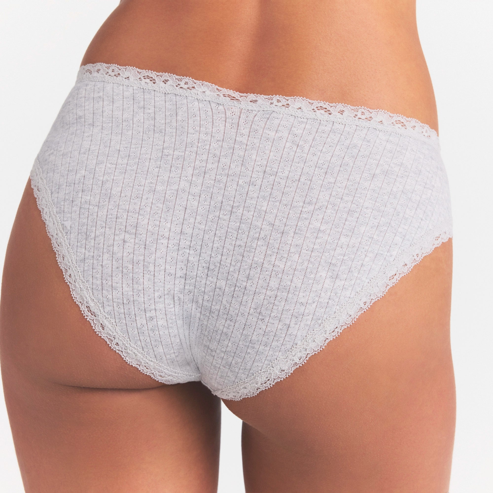 LIGHTWEIGHT COTTON POINTELLE LACE BRIEF | LIGHT HEATHER GREY ON A MODEL SIDE VIEW