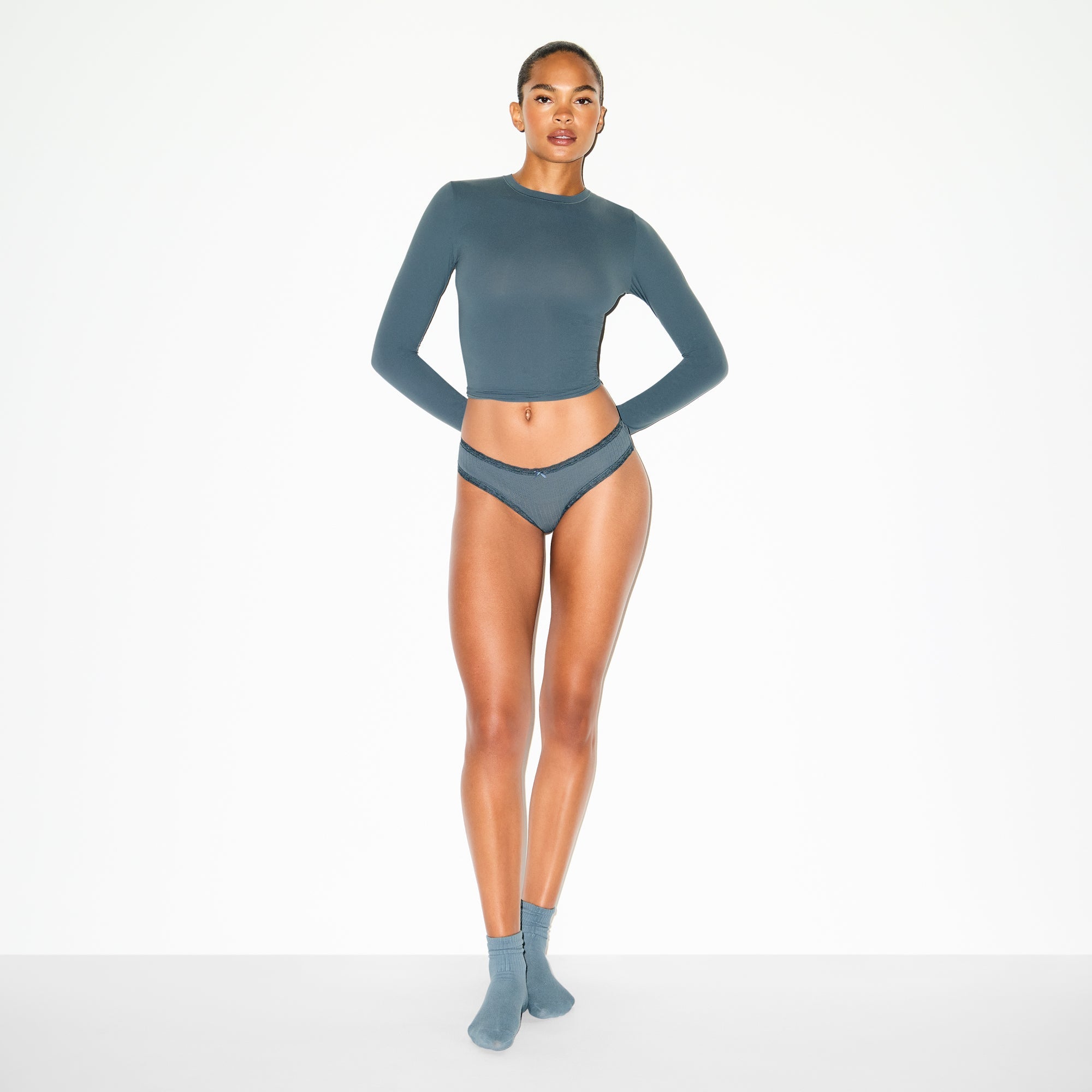 LIGHTWEIGHT COTTON POINTELLE LACE BRIEF | ZIRCON TONAL ON A MODEL FRONT VIEW @ | FOCUS: 0.0, 1.0, 0.9