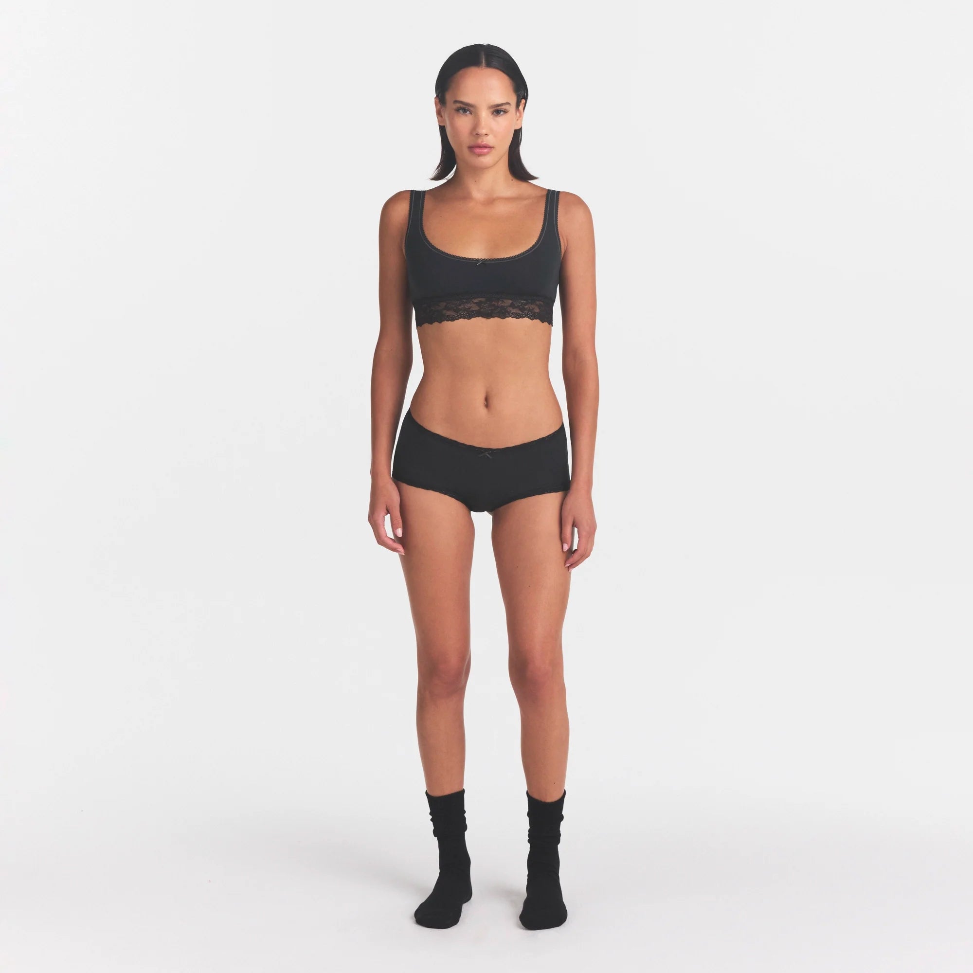 LIGHTWEIGHT COTTON LACE SCOOP BRALETTE | SOOT TONAL ON A MODEL FRONT VIEW