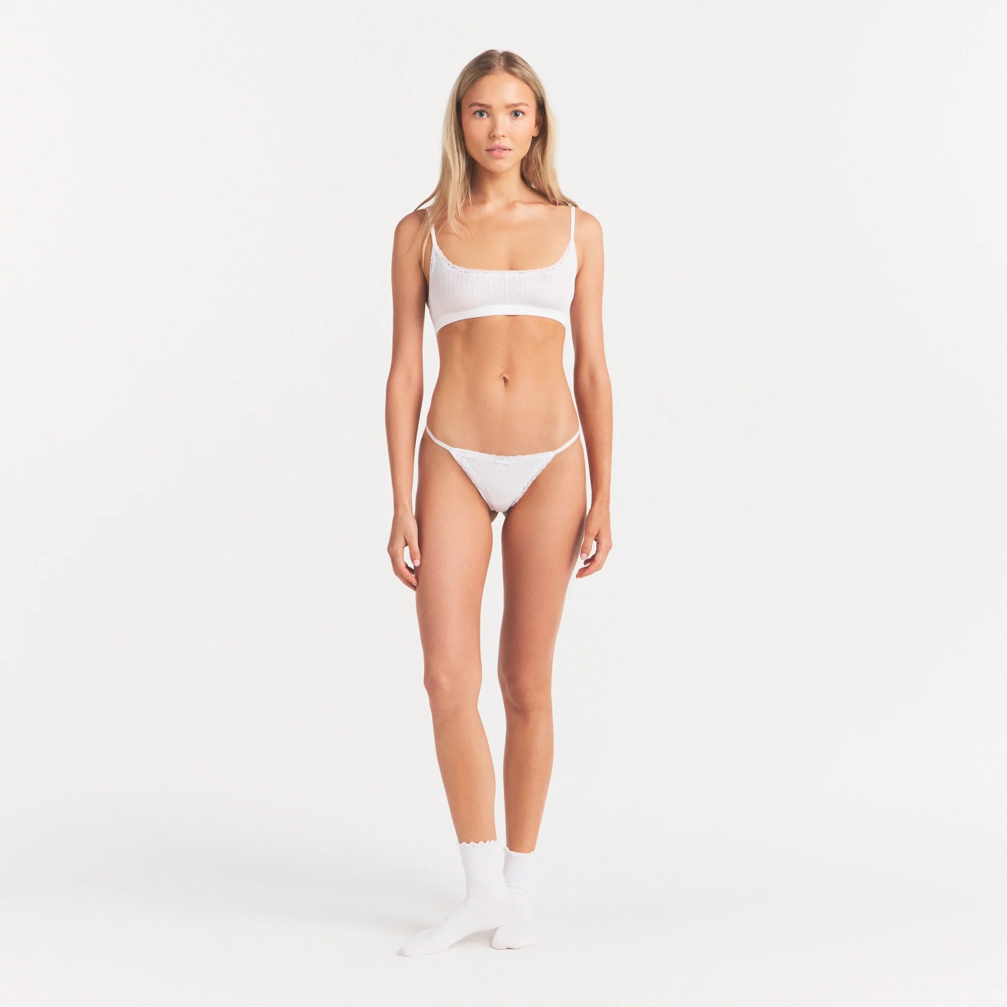 LIGHTWEIGHT COTTON POINTELLE SCOOP BRALETTE | SNOW ON A MODEL FRONT VIEW | FOCUS: 0.0, 1.0, 0.9