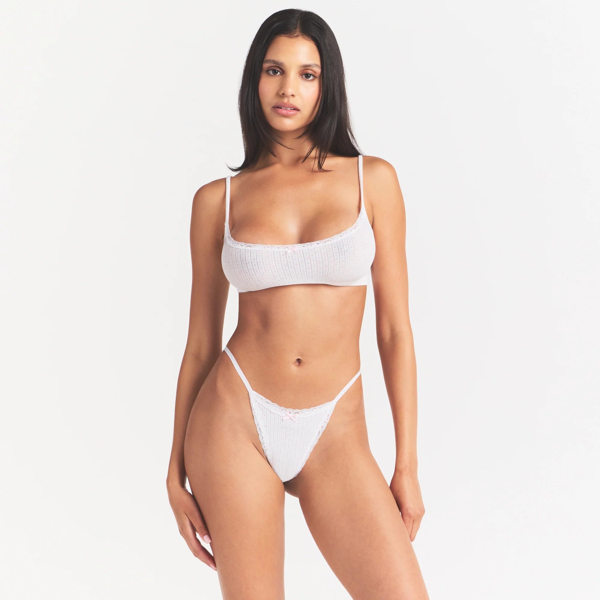 LIGHTWEIGHT COTTON POINTELLE SCOOP BRALETTE | SNOW PEONY PIN DOT ON A MODEL SIDE VIEW @ | FOCUS: 0.0, 1.0, 0.9