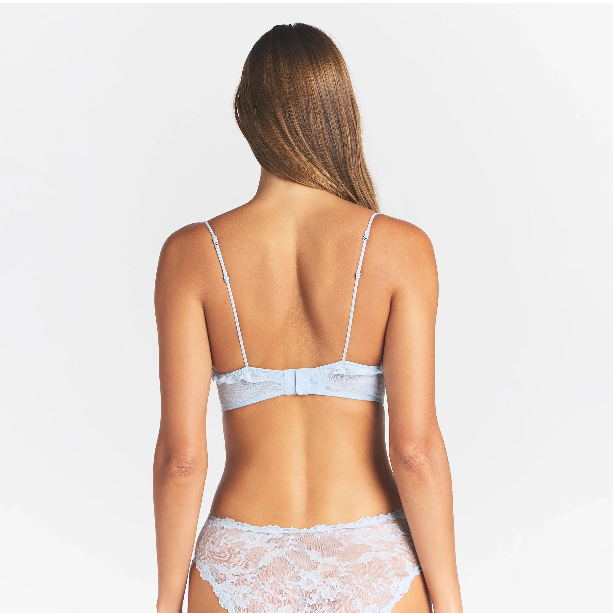 STRETCH LACE RUFFLE UNLINED BRA | POWDER BLUE ON A MODEL BACK VIEW @ | FOCUS: 0.0, 1.0, 0.9
