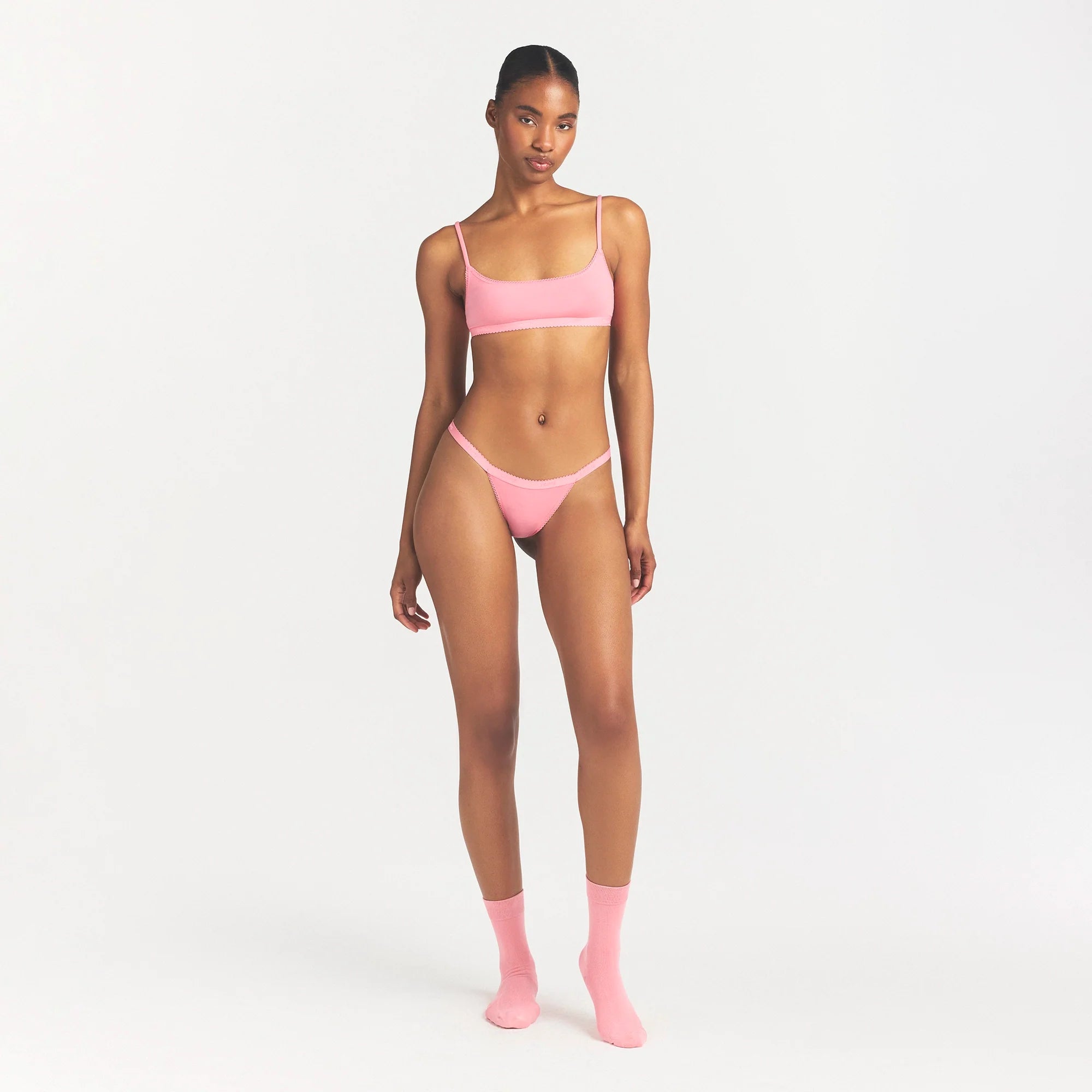 LIGHTWEIGHT COTTON LOGO PICOT SCOOP BRALETTE | MELON TONAL ON A MODEL FRONT VIEW @ | FOCUS: 0.0, 1.0, 0.9