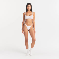 LIGHTWEIGHT COTTON LOGO PICOT SCOOP BRALETTE | SNOW ON A MODEL FRONT VIEW
