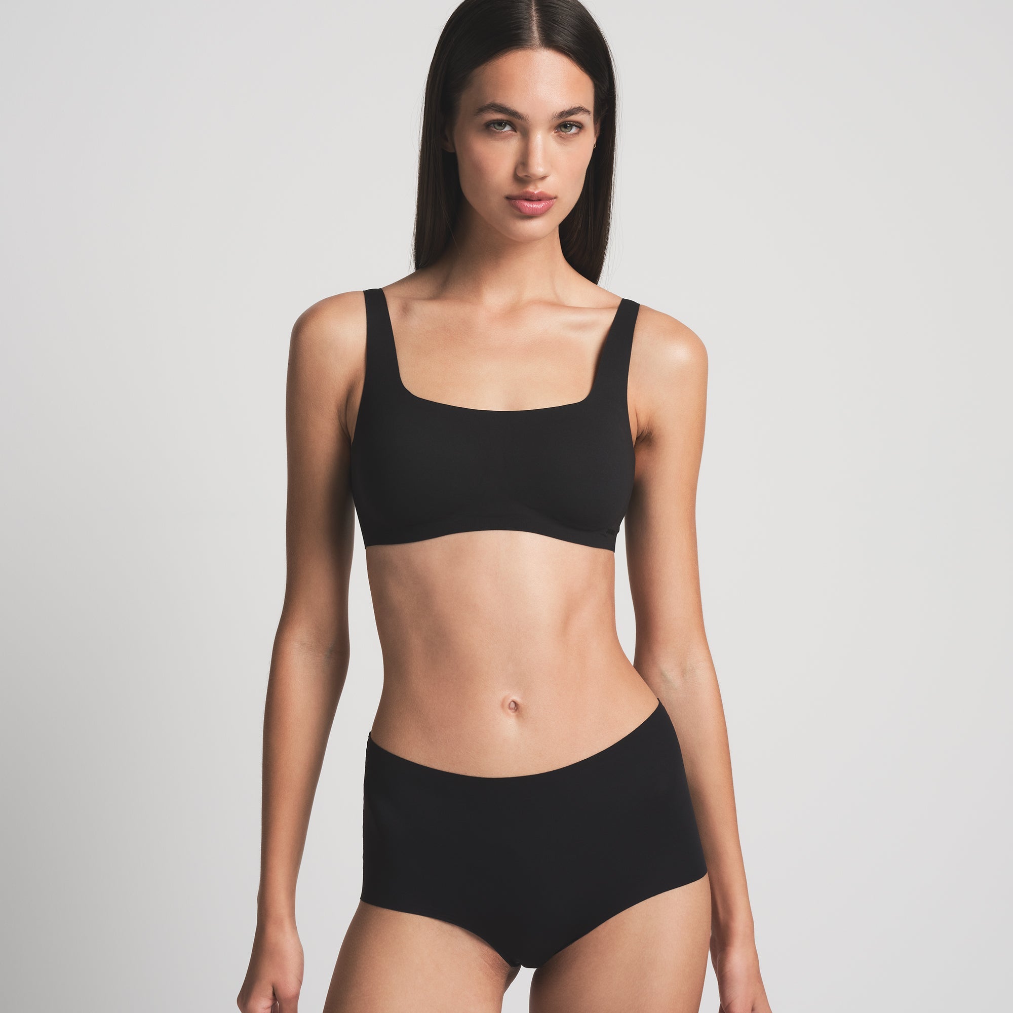 NAKED SCOOP BRA WORN BY A MODEL IN FRONT VIEW
