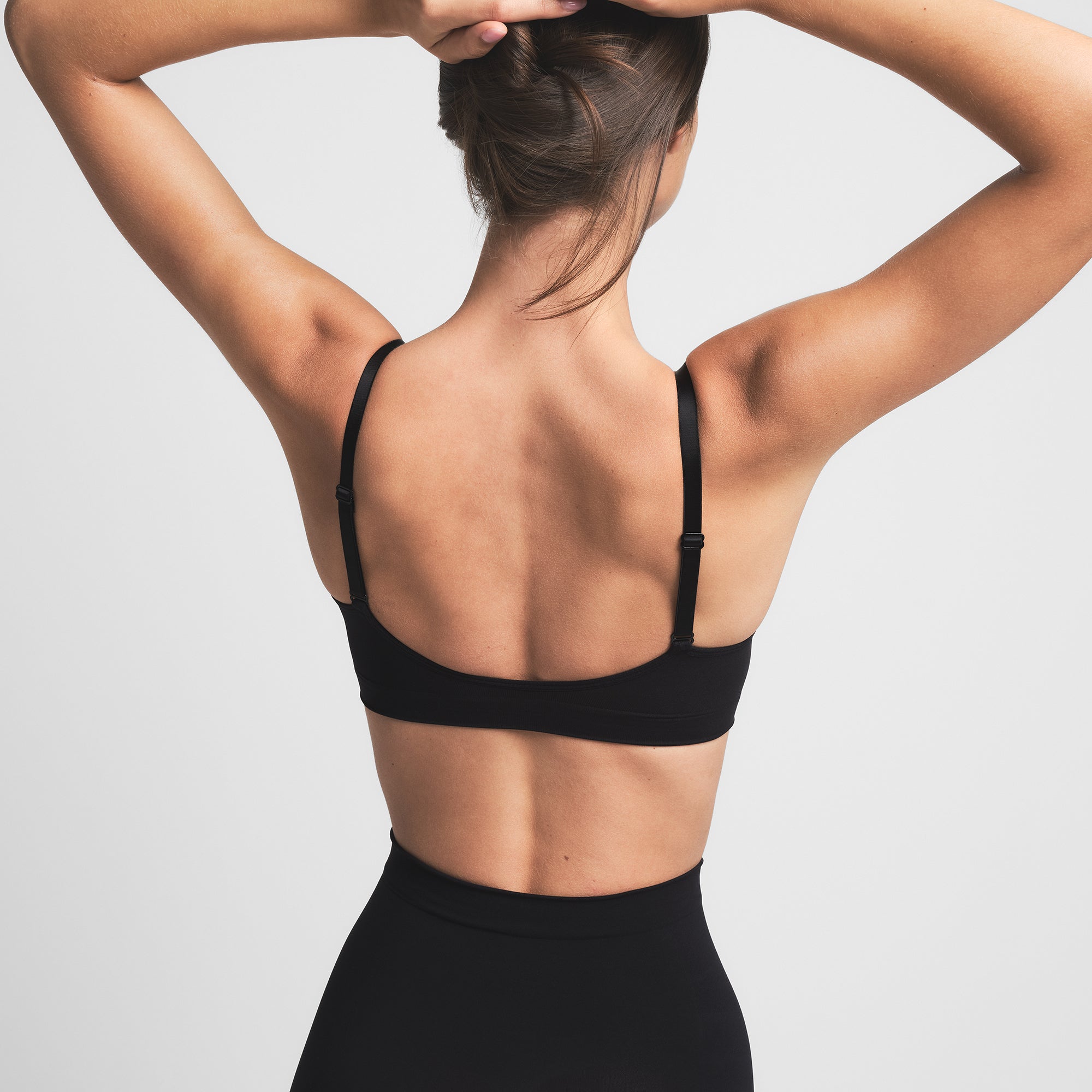 SEAMLESS SCULPT BRALETTE | ONYX ON A MODEL BACK VIEW