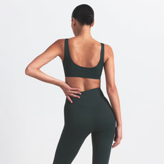 NikeSKIMS MATTE SCOOP NECK BRA | DARK TEAL ON A MODEL SIDE VIEW @ | FOCUS: 0.0, 1.0, 0.9