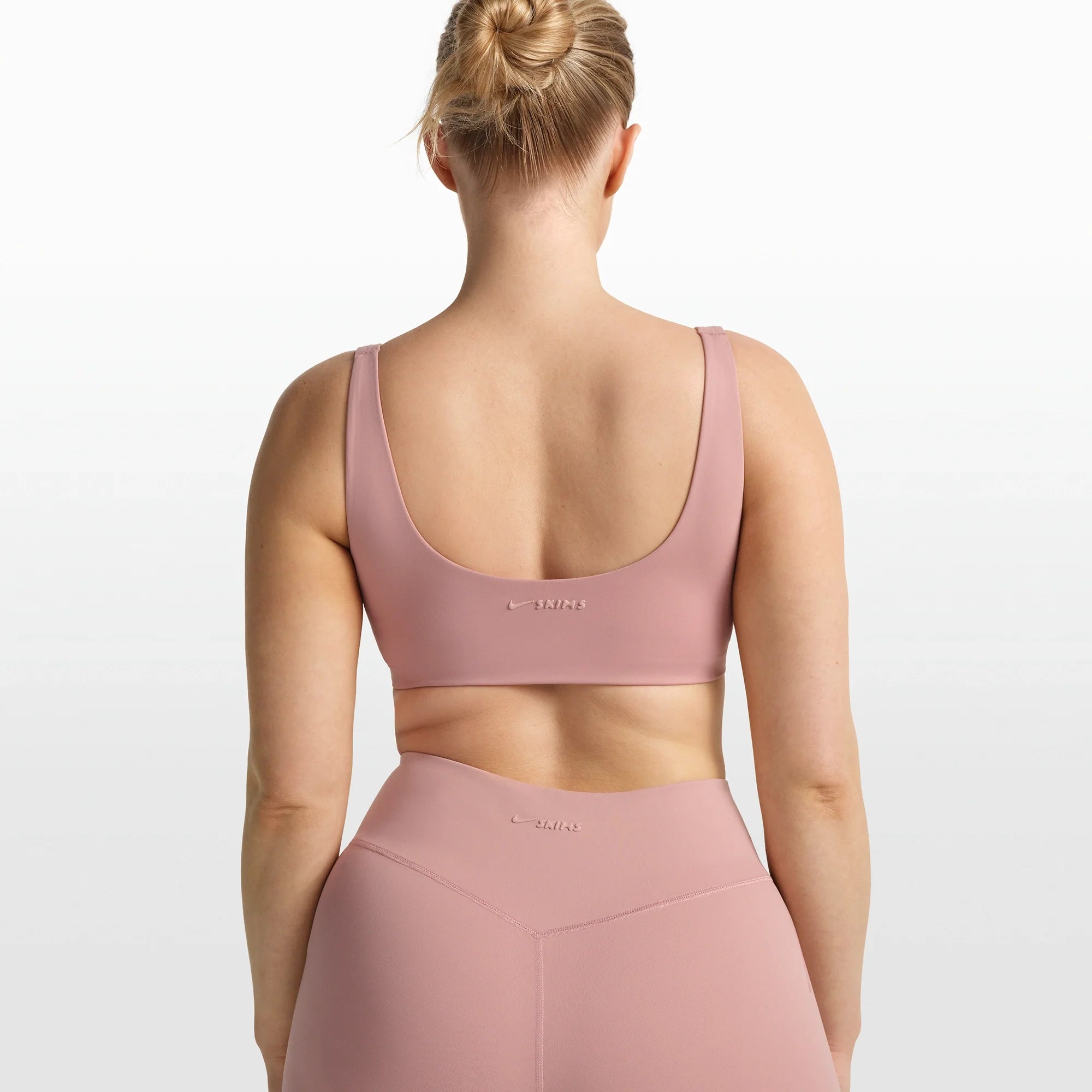 NikeSKIMS MATTE SCOOP NECK BRA | HIMALAYAN ON A MODEL FRONT VIEW @ | FOCUS: 0.0, 1.0, 0.9