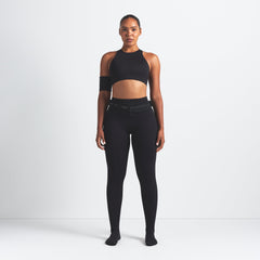 NikeSKIMS MATTE HIGH NECK BRA | OBSIDIAN ON A MODEL FRONT VIEW @ | FOCUS: 0.0, 1.0, 0.9