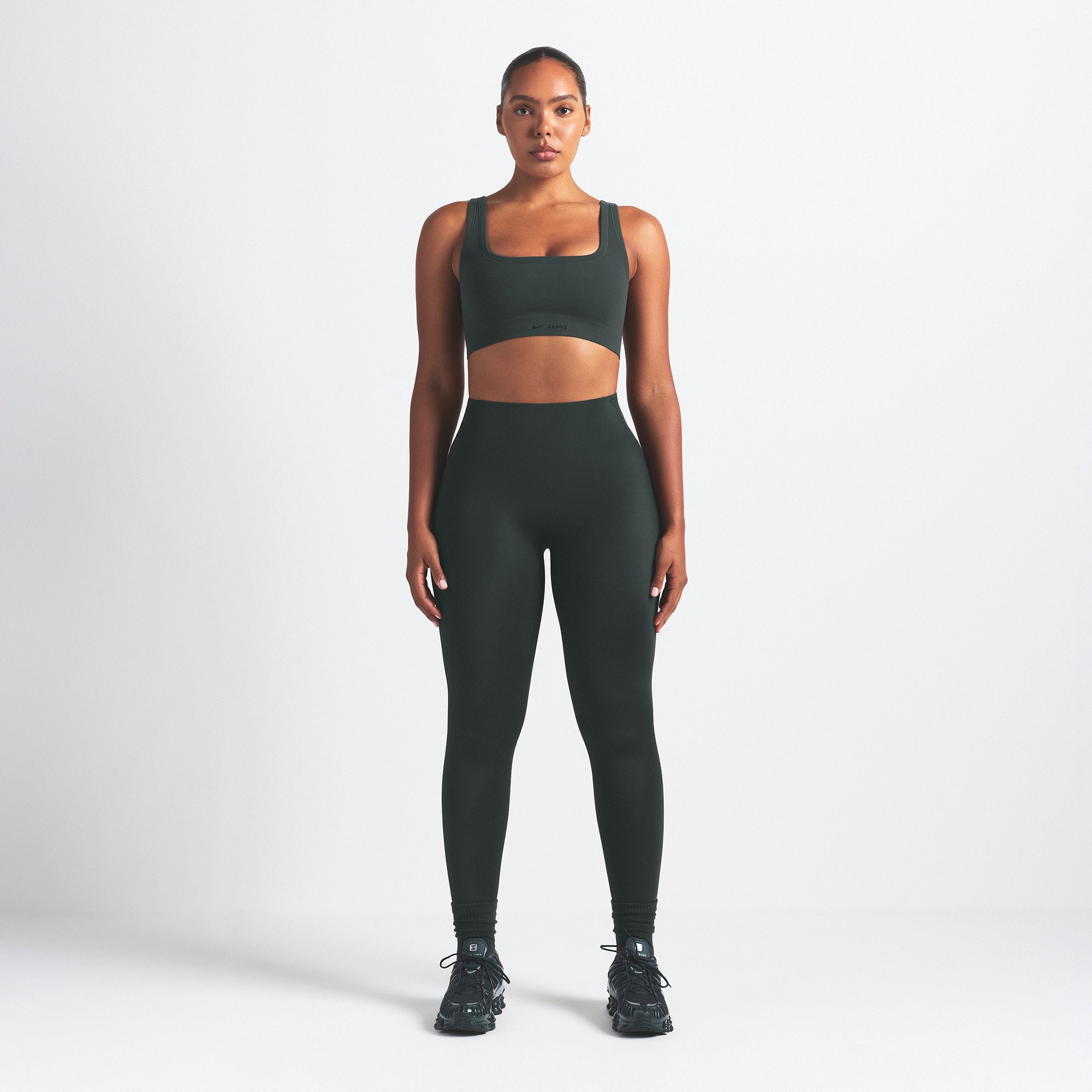 NikeSKIMS VINTAGE SEAMLESS SCOOP NECK BRA | DARK TEAL ON A MODEL FRONT VIEW @ | FOCUS: 0.0, 1.0, 0.9